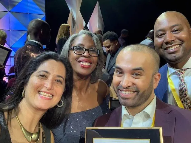 Vidya President Neil Chaudhuri (He/Him) with other Top 100 MBE Award winners