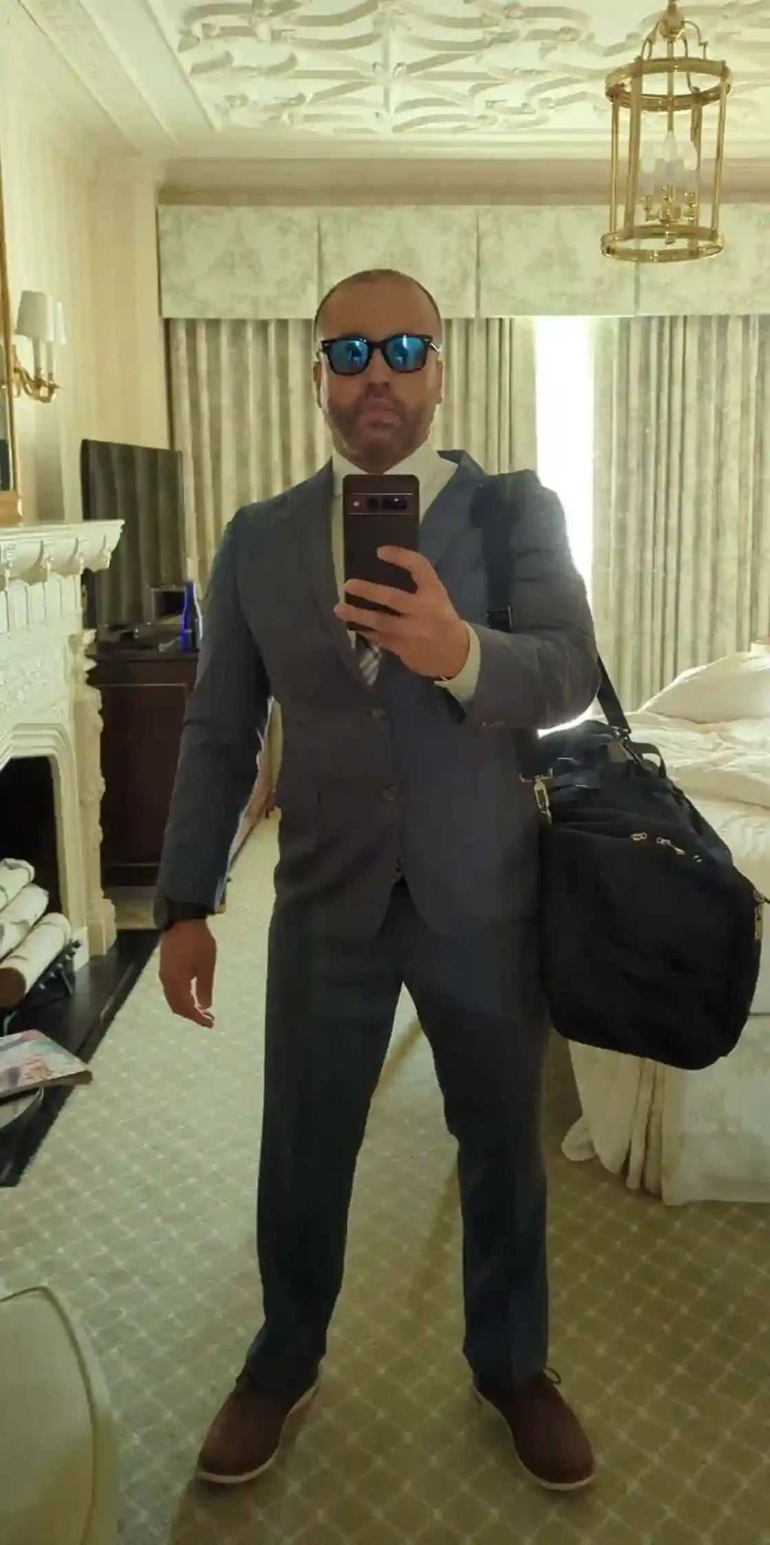 Neil Chaudhuri in suit and sunglasses.